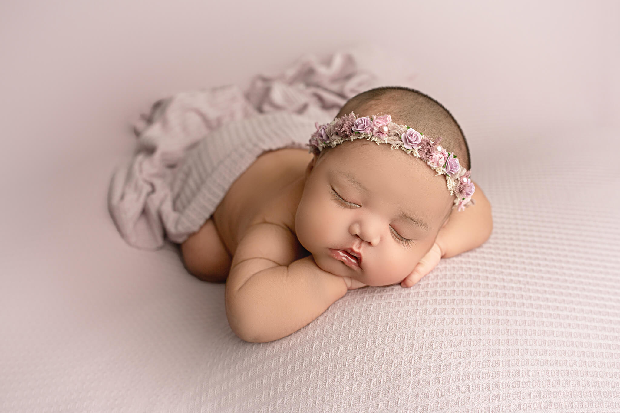 newborn baby posed on purple backdrop, hamilton, on