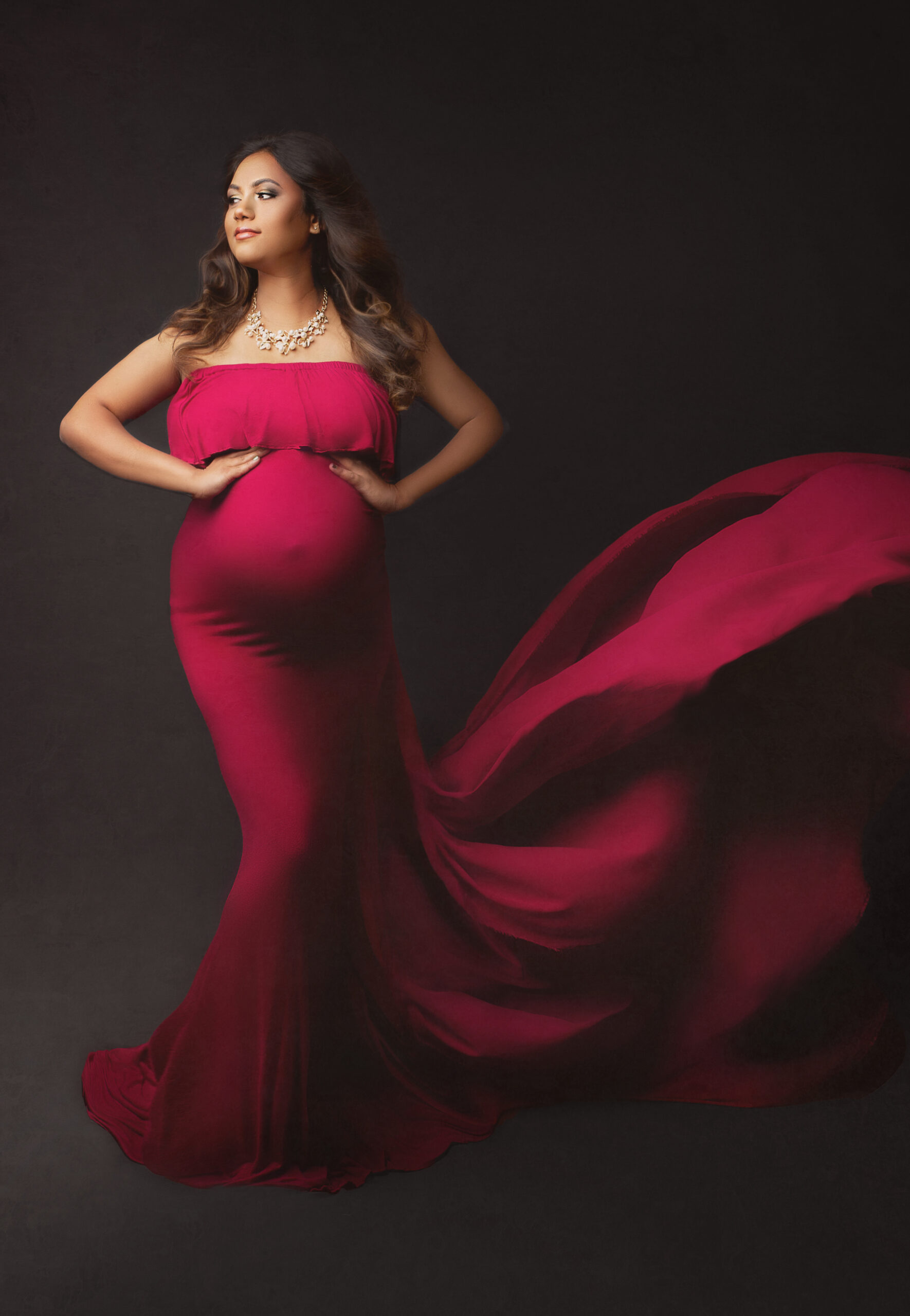 beautiful expecting mother wearing red maternity gown during hamilton photoshoot